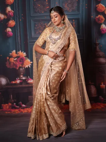 A graceful, full-length pose showing the flow of the saree and the elegance of the complete bridal jewellery set.