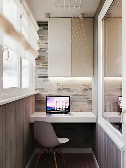 This modern balcony office uses interesting wall panels and under-cabinet lighting to create a bright and efficient workspace. The design is clean, compact, and highly functional.