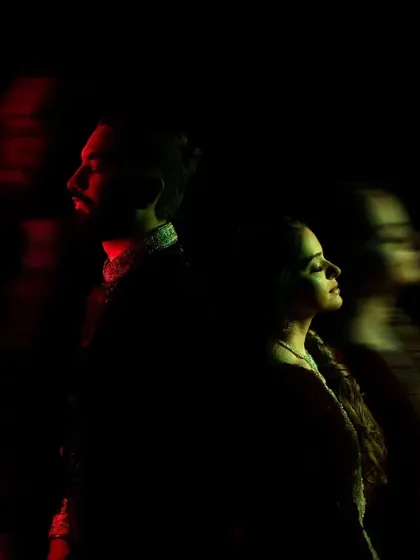 An experimental shot using motion blur and red light to create an abstract and moody portrait. This artistic style focuses on feeling and atmosphere rather than perfect clarity.