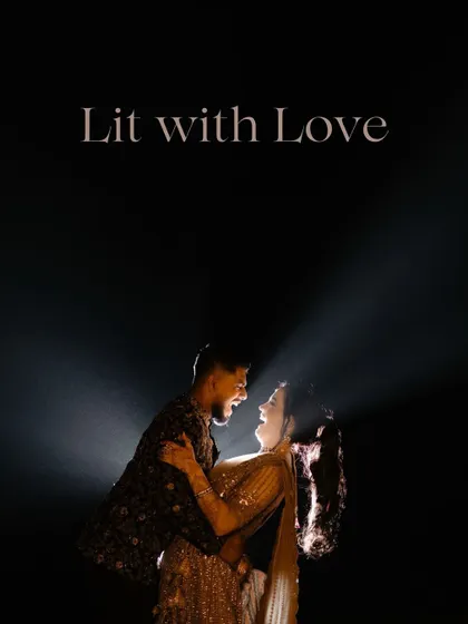 A dramatic and romantic shot of the couple, lit from behind, creating a beautiful silhouette against the night sky.