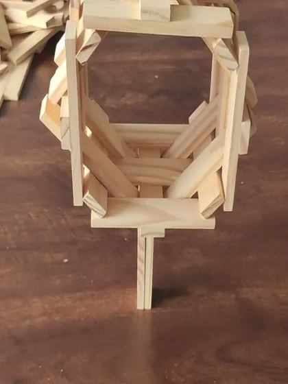 A close-up of a structure balanced on a single point. Achieving this level of precision requires deep analysis and understanding of the materials, breaking a complex problem down into smaller, manageable parts.