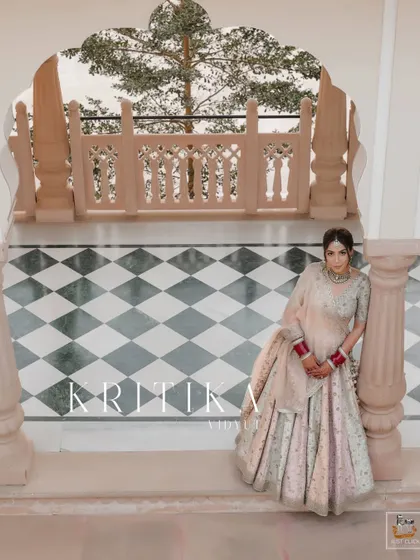 A serene bridal portrait at The Jaibagh Palace, capturing a moment of quiet reflection.