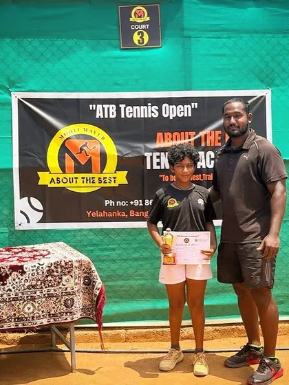 A duplicate shot of our girls' singles champion, Eshitha, with her coach.