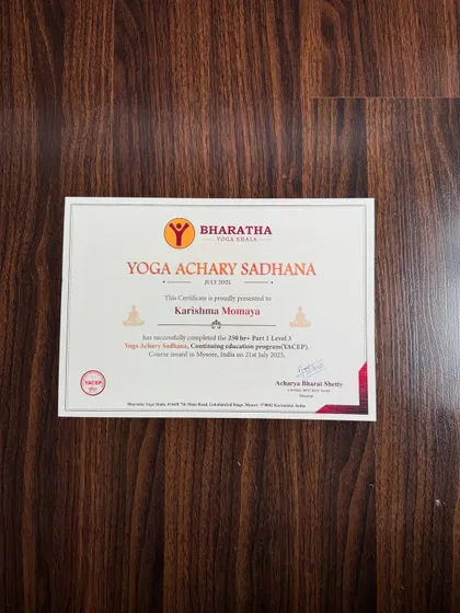 My Yoga Acharya Sadhana certificate. This is not just paper; it is a responsibility to share what I have learned with grace and integrity.