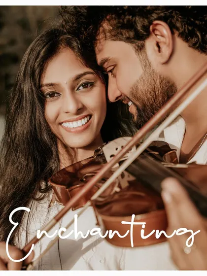 A close-up of the bride-to-be's enchanting smile as her partner plays the violin.