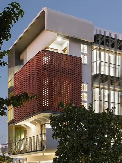 A duplicate image of the house at dusk.