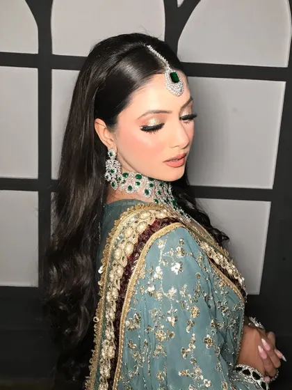 An eyes-closed shot to showcase the soft gold and brown eyeshadow.