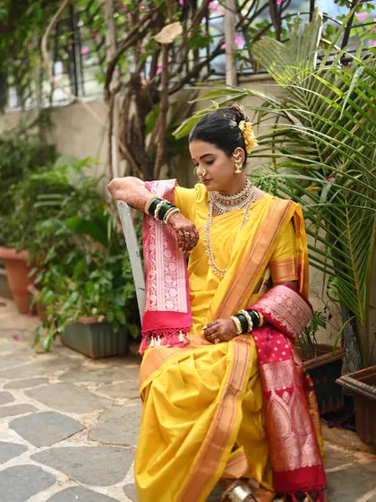A moment of quiet reflection. The beautiful fall of the Nauvari drape and the rich texture of the silk create a picture of pure grace.