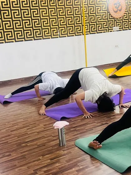 The Prasarita Padottanasana, or wide-legged forward bend. This pose helps to calm the mind while stretching the legs and spine.