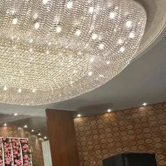 Another angle of the stunning chandelier, showing how it illuminates the entire space and adds a touch of opulence to the event.
