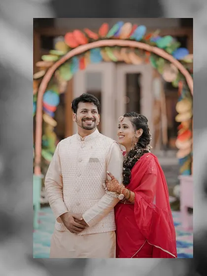 A sweet and simple portrait of the couple from their pre-wedding festivities. The black and white edit with a color focus draws attention to their happy expressions.