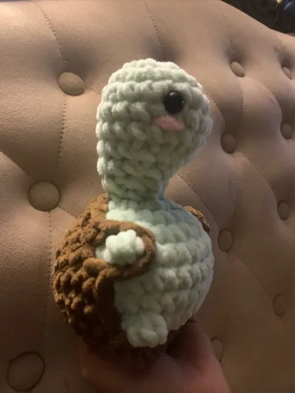 Meet Tabby the Turtle! This amigurumi was made with a thick, plush yarn for maximum softness and features cute little blush details.