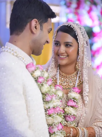 A close-up of the bride and groom sharing a happy, candid moment right after their ceremony.