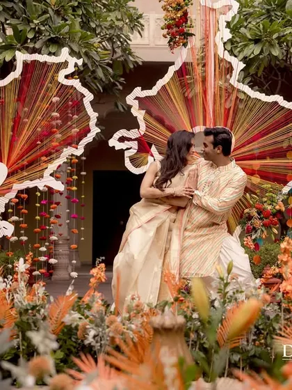 The happy couple poses in front of the custom map installation, a beautiful and meaningful backdrop that tells their personal story.