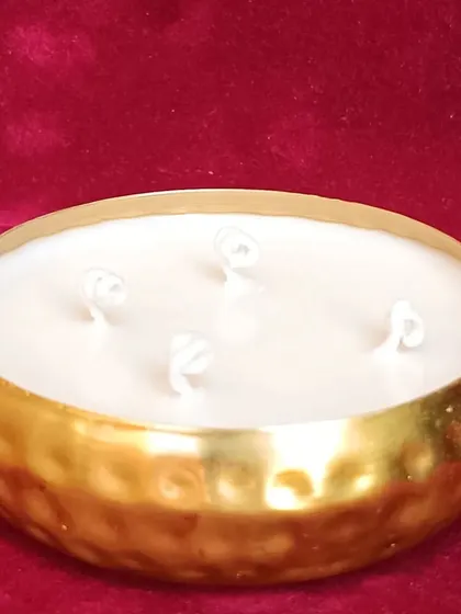 The hammered golden urli candle, a versatile piece for any festive hamper.