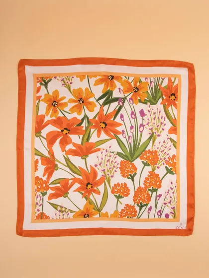 A flat-lay of the orange floral pocket square, perfect for showcasing the full print.