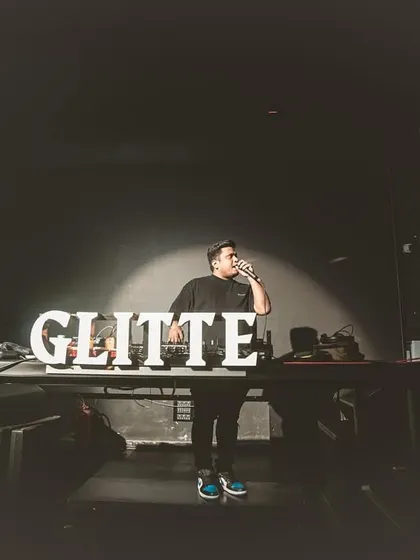 On the mic at Glitte, getting the crowd hyped for the next track. A key part of my performance is direct interaction and hyping the audience.