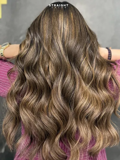 Your hair deserves to shine this bright. This look features a beautiful blend of highlights that create incredible dimension and gloss.