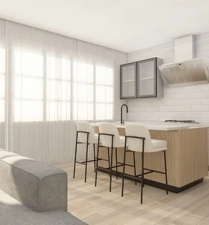 The kitchen island with bar stools creates a natural gathering spot, perfect for morning coffee or chatting with the cook.