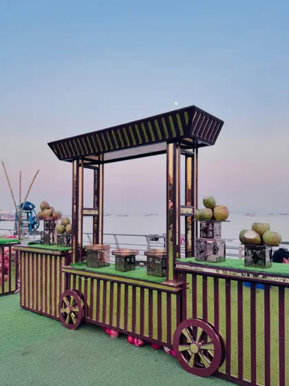 The coconut water cart at dusk, with the ocean in the background.