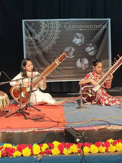 Two of my students performing a sitar duet during our Gurupoornima celebration. It is a special moment to see them share their music with others.