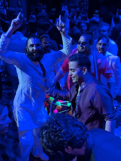 A sangeet night turned into a Bollywood set with the one and only Ranveer Singh. We were thrilled to share the stage and match his incredible energy.