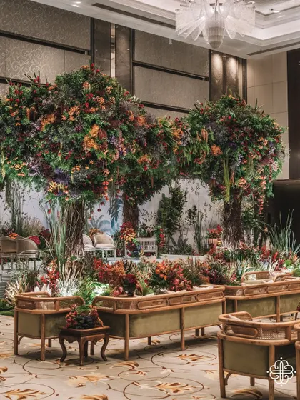 A wide view of the 'Orchard of Life' naming ceremony, showing the scale of the indoor forest we created.