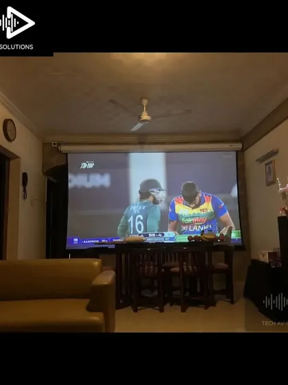 Another example of a home theater setup being used to watch a live cricket match. The large screen makes you feel like you're part of the crowd.