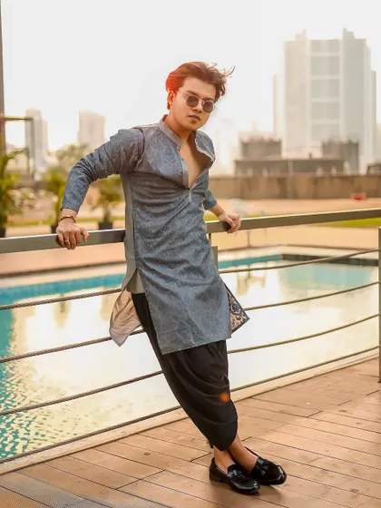 A variation of the men's ethnic wear shot, with a slight hair flip adding movement.