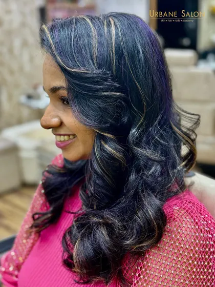 Our client is all smiles with her new Crazy Violet and Blonde highlights. This look is fun, edgy, and completely unique.