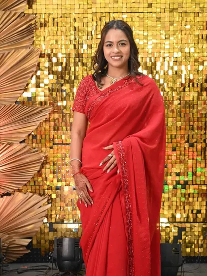 Another beautiful shot of the bridesmaid. The simple makeup and hair let her natural beauty and the vibrant saree shine.