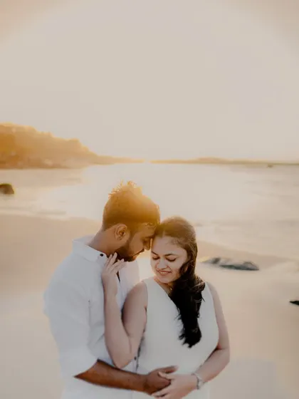 There's something magical about the golden hour light on a quiet Mumbai beach. For this pre-wedding session, we kept it simple with white outfits, letting the warm sunset and the couple's gentle interaction create a soft, romantic atmosphere.