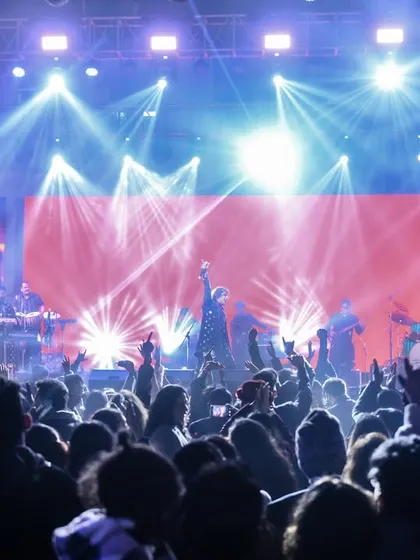 A wide shot of our New Year's Eve concert, showcasing the impressive light show and the massive crowd that came to celebrate with us.