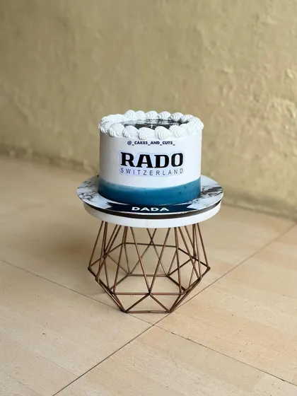Another view of the Rado watch cake, showing the clean lines and edible branding.