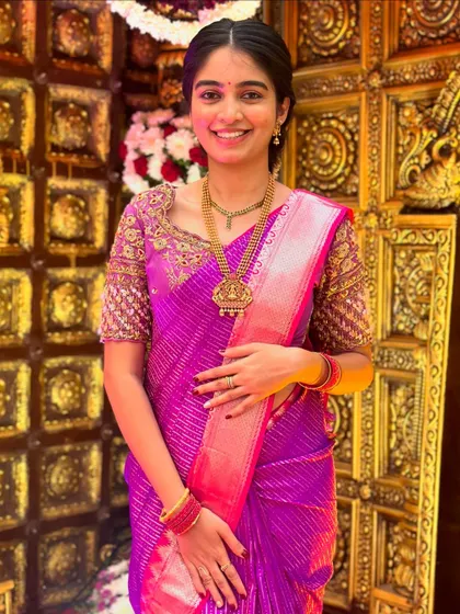 The client looking radiant in her complete traditional outfit, perfect for a wedding or festive celebration.
