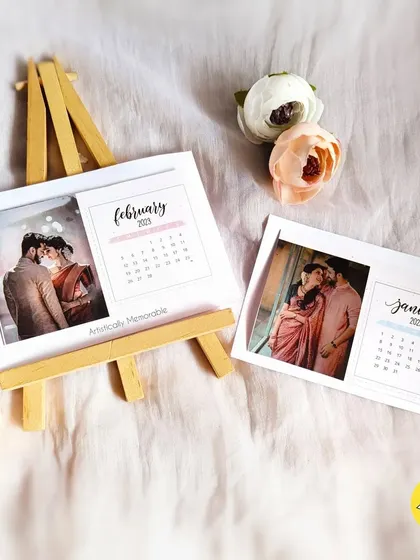 Another view of the personalized desk calendar set, showing the January and February cards with their wooden easel stand.