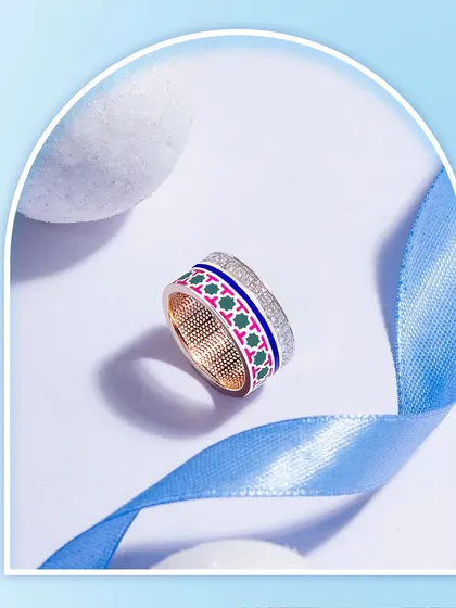 Natural Diamonds and French Enamel entwined with the finesse and charm of intricate artistry in every curve of this beautiful thumb ring.