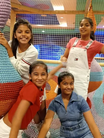 Chilling out in the woven nest climbers. These colorful structures are great for climbing, hiding, and socializing with friends.