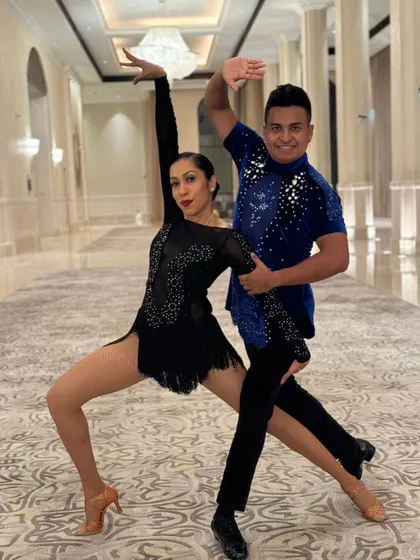 A series of photos from a professional performance in Abu Dhabi. These shots capture the different poses, lines, and moments from our polished Salsa duet, highlighting our performance costumes and stage-ready look.