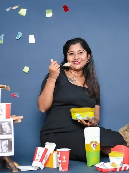 A fun and unique pregnancy announcement celebrating cravings. This mom-to-be is surrounded by her favorite ice cream, with her cute dog by her side.