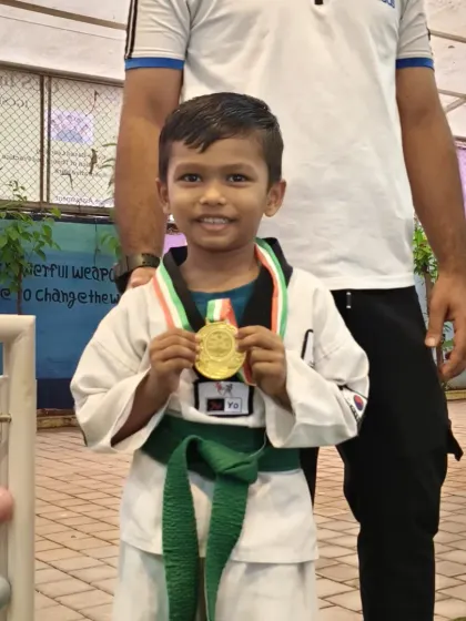 A close-up of our district champion, Uzaif, with his gold medal. The smile says it all.