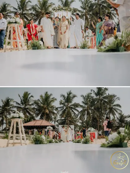 The view from the wedding aisle, looking towards the mandap set against the beautiful beach and palm trees.