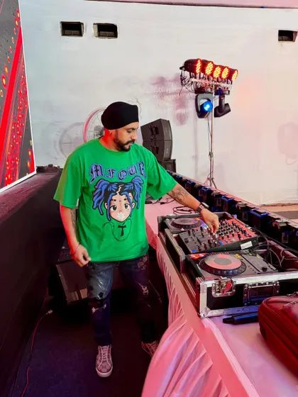 In the zone during a jam-packed Saturday night. I manage the music and lighting from my professional DJ console, ensuring a seamless flow of energy until the early morning hours.