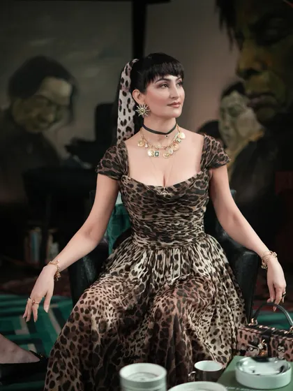 Capturing the essence of Italian glamour. This shot shows how the styling, from the hair scarf to the jewelry, came together to create a powerful character moment for the show.