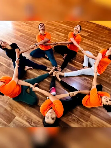 More fun with group yoga formations! These images capture the playful spirit and strong bonds forged in our training programs. It's all about connection and support.