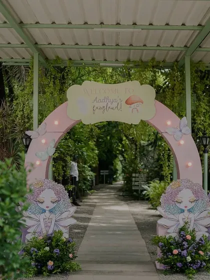 Guests were welcomed to this fairyland party through a beautiful arched entryway, flanked by adorable fairy cutouts and flowers. The path invites you into a world of wonder.