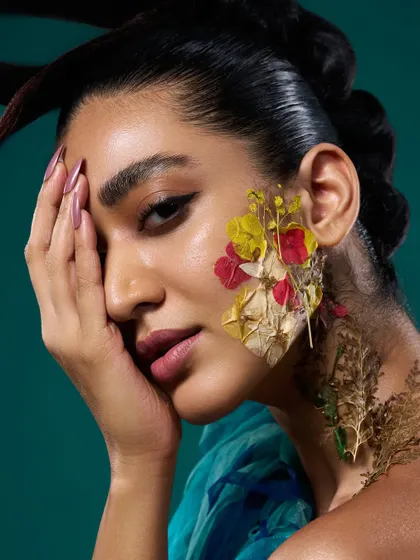 For this conceptual beauty shoot, we used pressed flowers on the skin. The lighting had to be soft enough to not wash out the delicate flowers but crisp enough to capture the skin's texture.