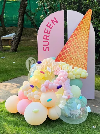 We all scream for ice cream. This sweet-as-can-be birthday setup featured a custom backdrop with a giant melting ice cream cone made entirely of balloons. The pastel colors and sprinkle details made it the perfect photo spot for a fun and delicious celebration.