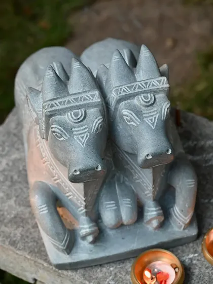 A frontal view of our 'Jodi Nandi' statue, showing the two bulls adorned with jewels and Lord Shiva's nama, facing forward together.