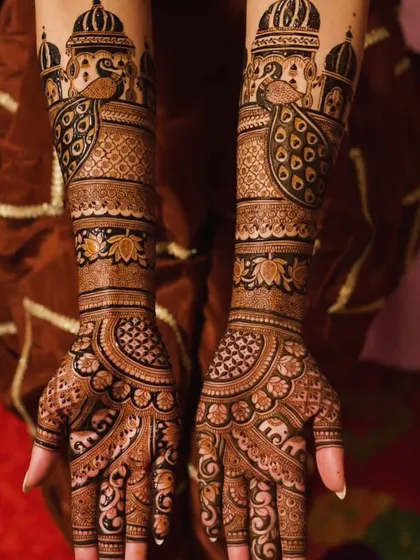 I love creating designs with a royal feel. This one features palace architecture and proud peacocks on the arms, with intricate jaali (net) patterns on the hands.